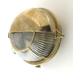 Edit Coastal Tide Outdoor Flush Wall Light - Brass